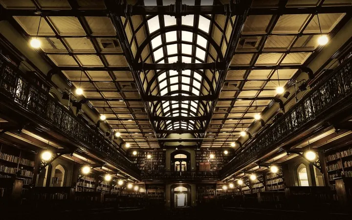 A reading room lined with books and study desks